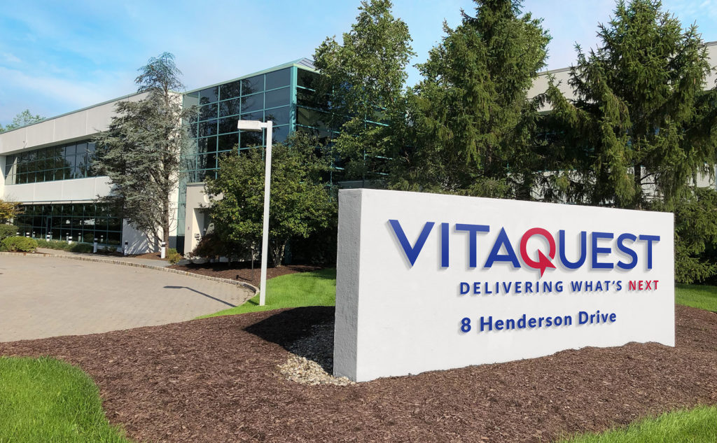 The exterior of Vitaquest's West Caldwell, headquarters building with the company signboard at 8 Henderson Drive.